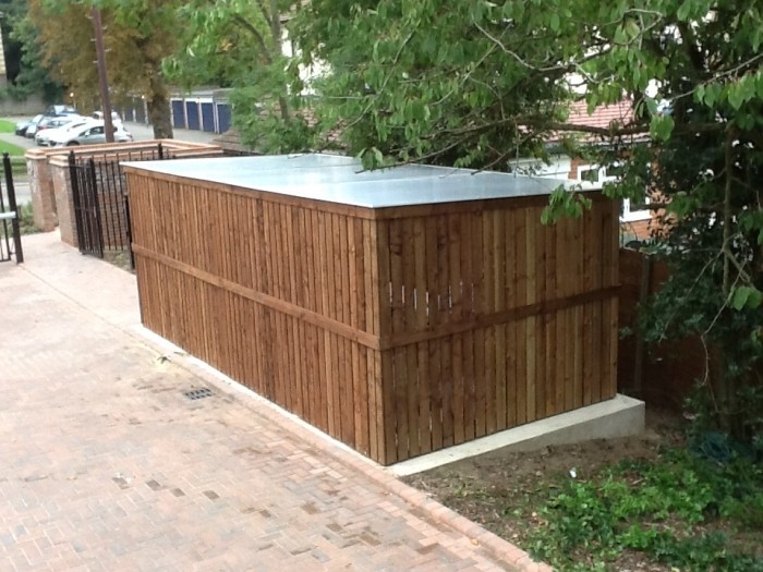 Image of a wooden bike shelter with fire treated timber