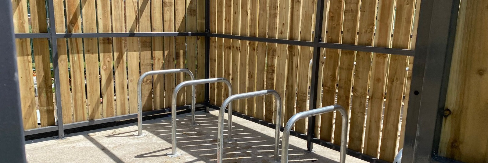 A timber clad cycle shelter